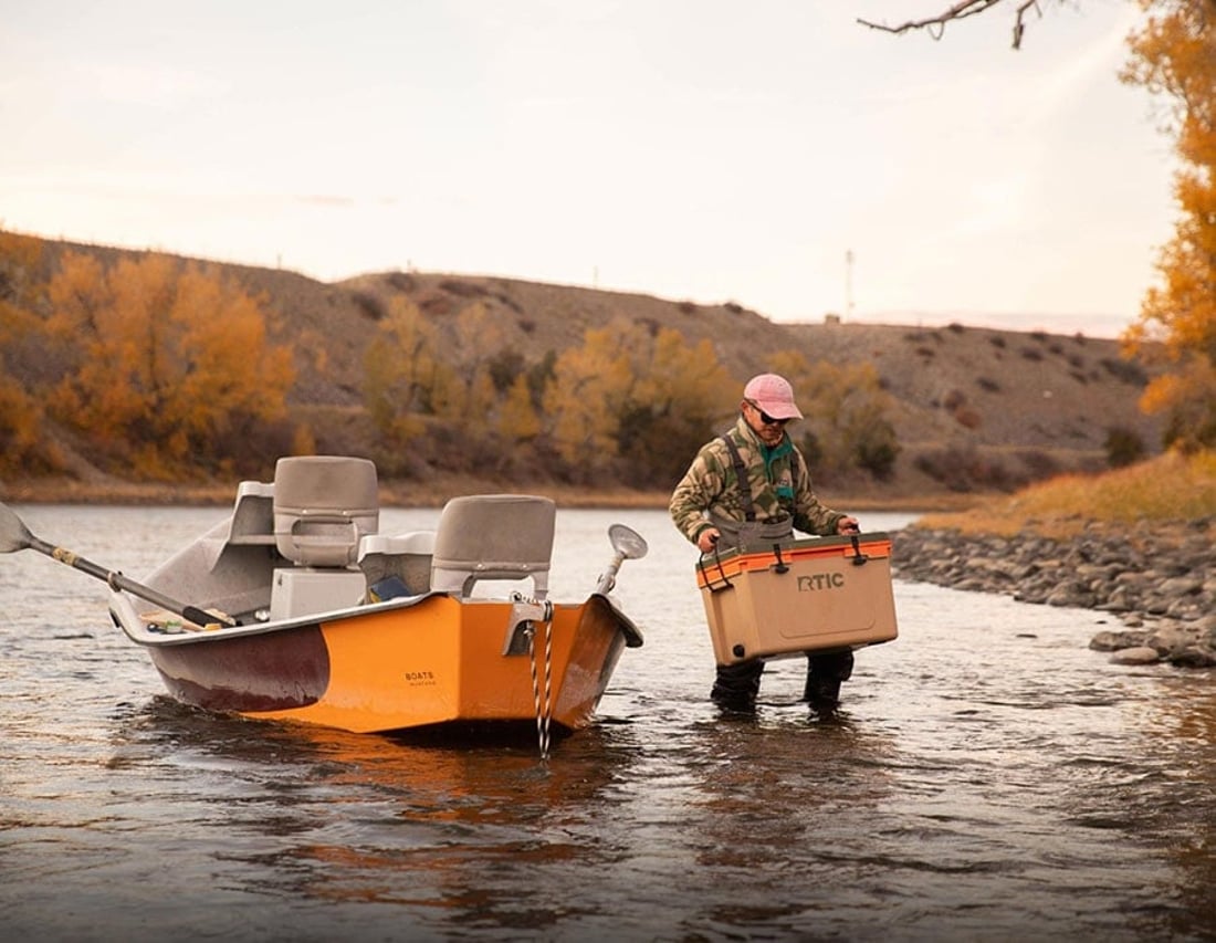 Man carrying RTIC 52QT Ultra-Light Cooler