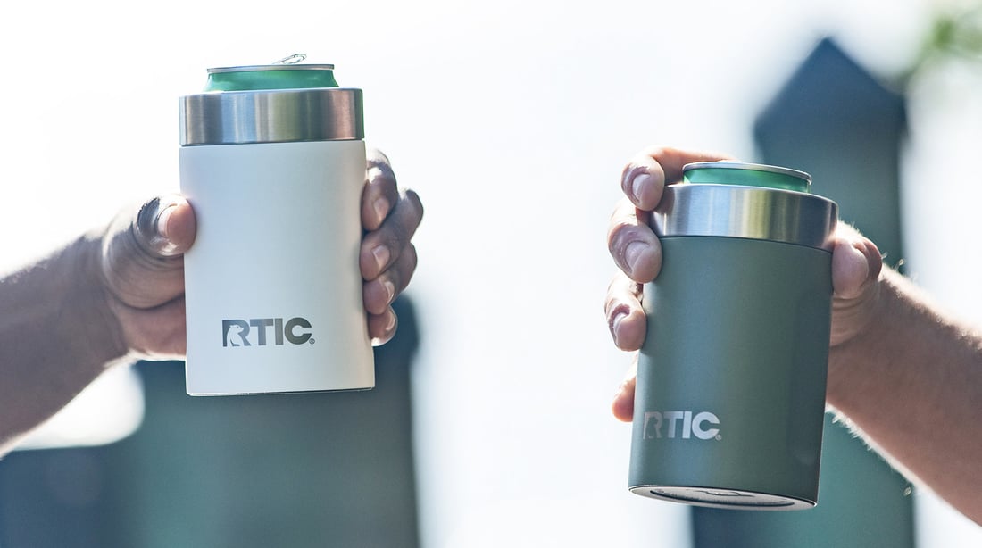 Close-up image of a person holding a RTIC Ultimate Can Cooler.