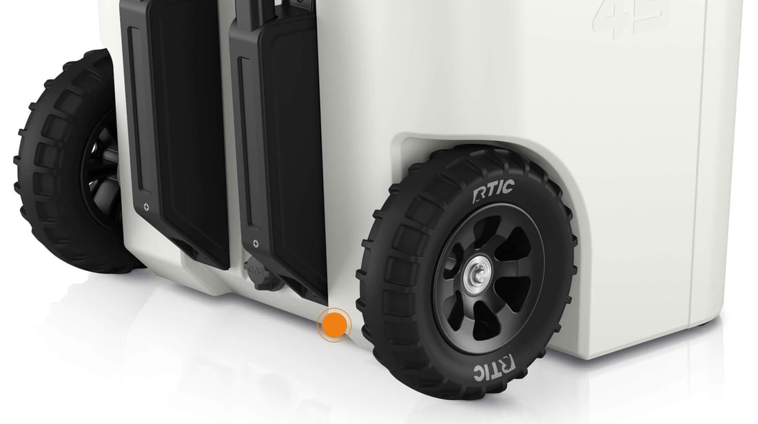 Close up on 45QT Ultra-Tough Wheeled cooler fully protected wheel axle