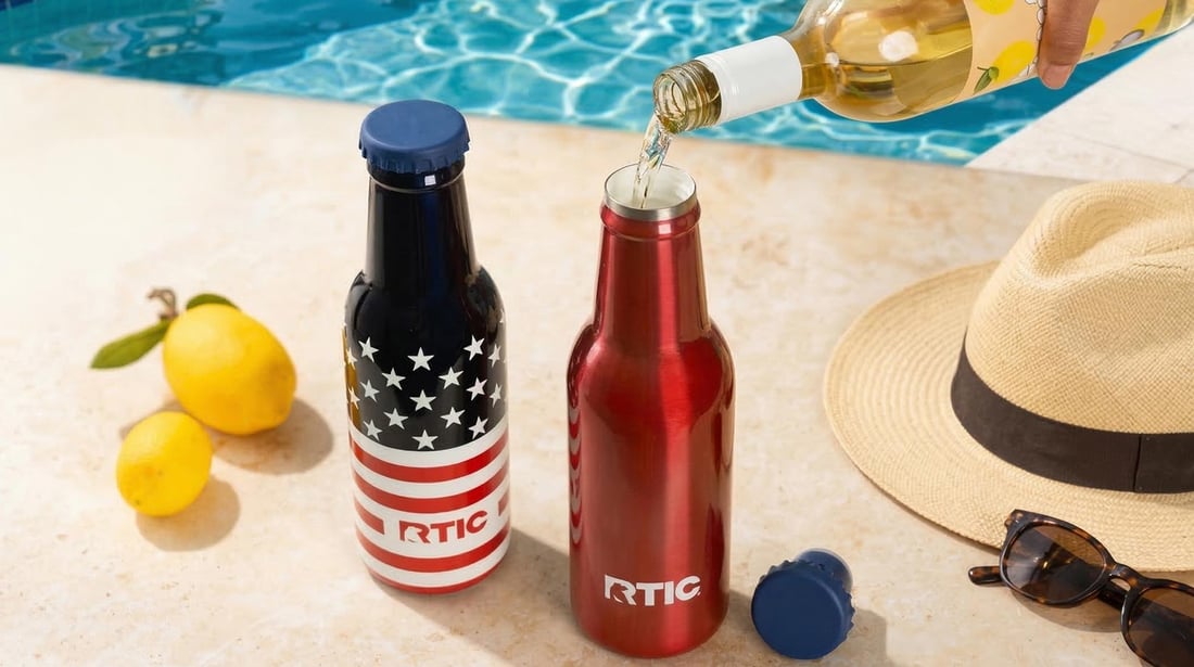 Two RTIC Sidekick Bottles sitting next to each other on a pool deck.