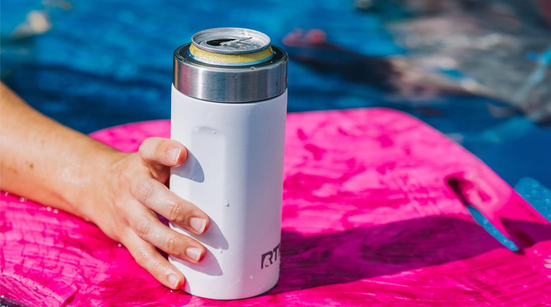 Fun on a pool float with a white RTIC Ultimate Craft Can Cooler.