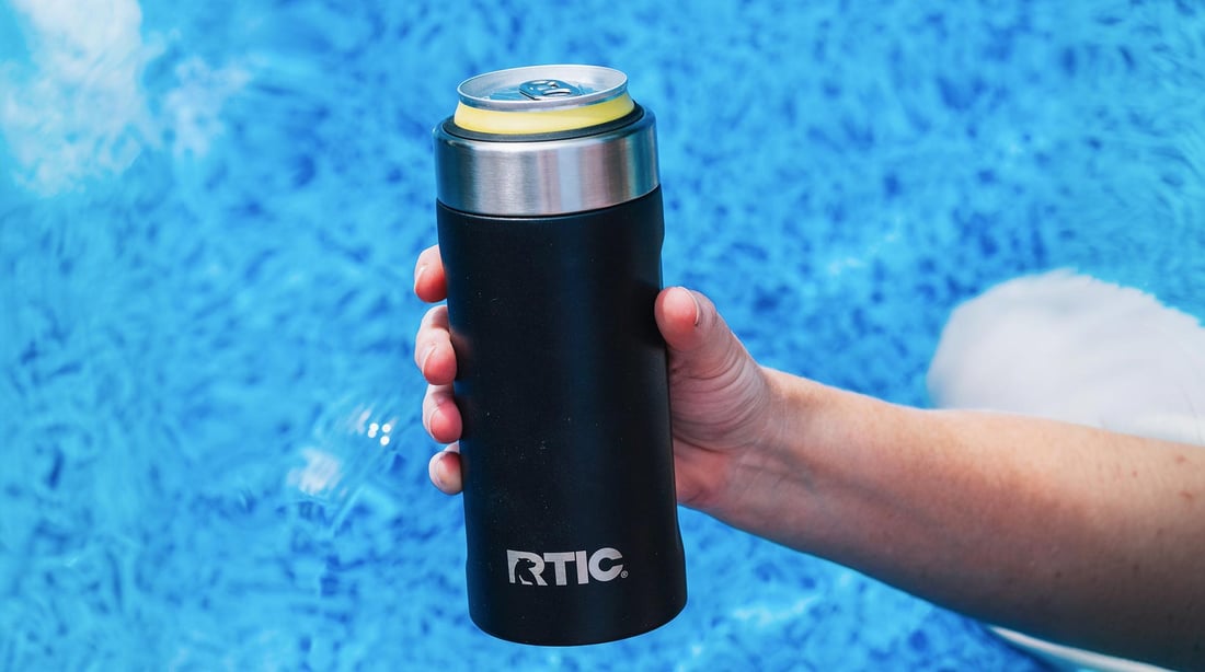 Fun on a pool float with a black RTIC Ultimate Skinny Can Cooler.