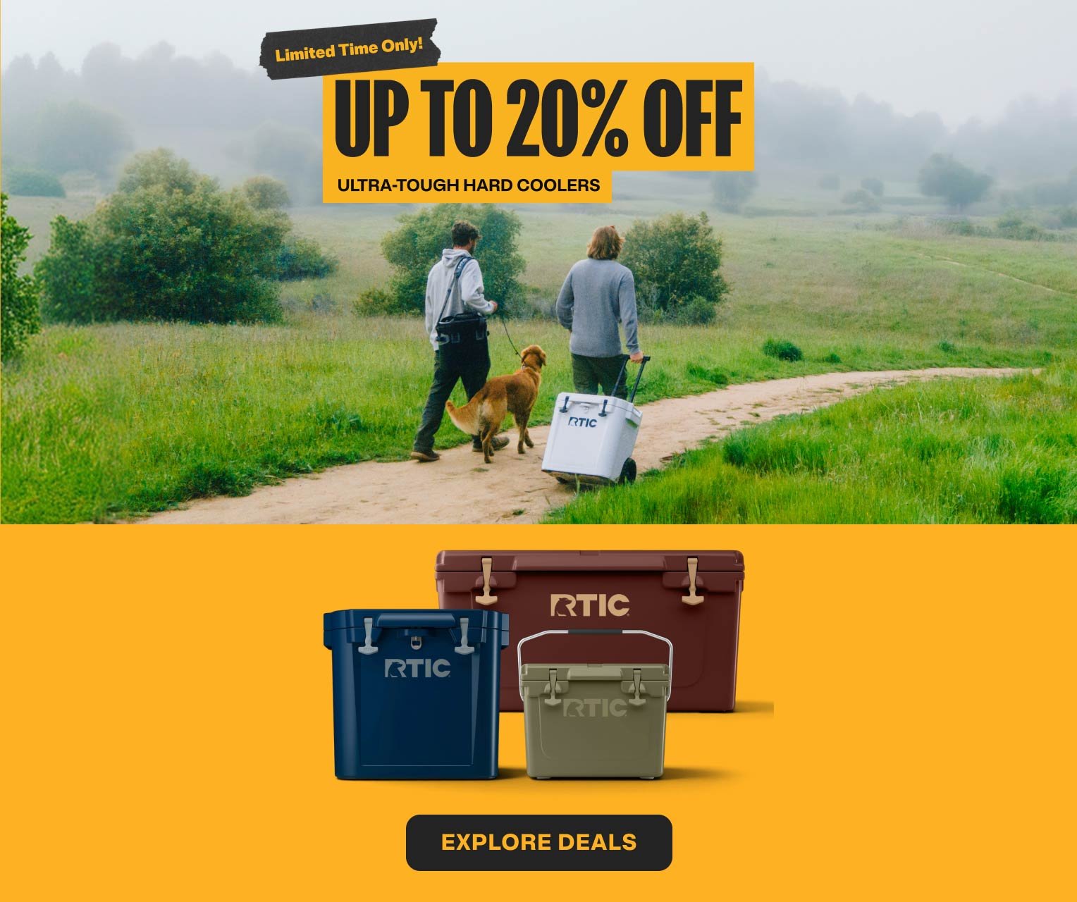 Hikers walking a dog on a dirt path next to a white wheeled cooler, adjacent to navy blue, olive green, and dark brown RTIC hard coolers.