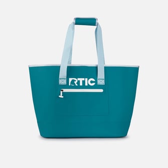 A teal RTIC tote bag on a light grey background.