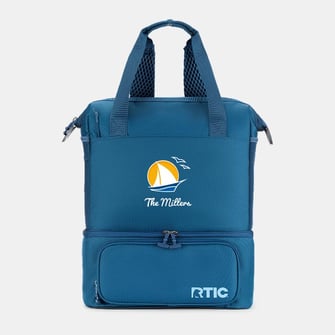 A blue RTIC backpack cooler personalized with "The Millers" and a sailboat on it on a light grey background.