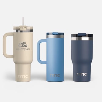 One beige RoadTrip tumbler personalized with the name Ella, one light blue travel mug, and one navy tumbler