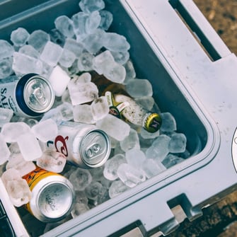A close-up on a RTIC hard cooler full of ice.