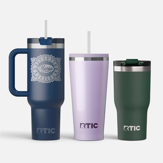 A group of RTIC insulated tumblers of varying sizes and shapes on a light grey background.