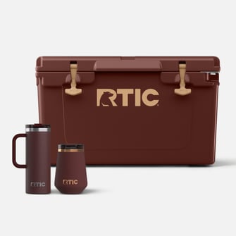 Chocolate brown RTIC coolers and drinkware on a light grey background.