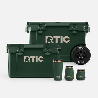 RTIC dark green cooler collection with two hard coolers and three insulated drinkware pieces on a white background