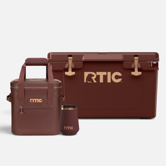 Chocolate brown RTIC coolers and drinkware on a light grey background.