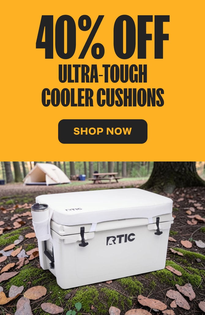 A white RTIC Ultra-Tough Hard Cooler with a cushion on top on a yellow background with "40% Off" above it.