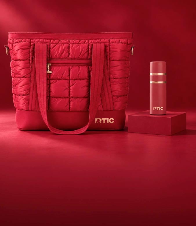 A monochromatic red scene featuring a quilted RTIC tote bag next to a matching RTIC insulated travel bottle on a pedestal.