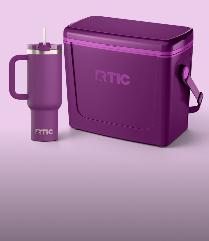 A purple RTIC cooler and matching handled tumbler with a straw are displayed against a light purple background.