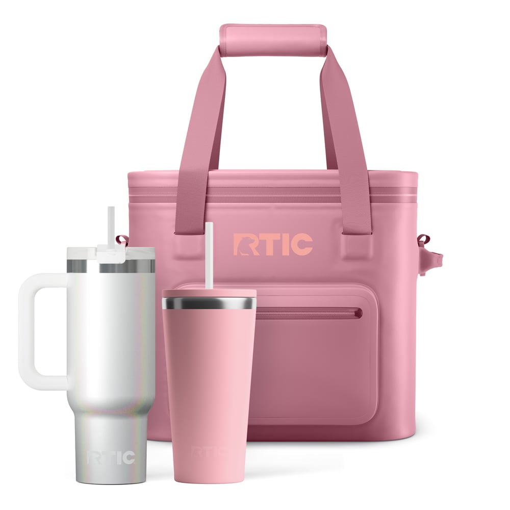 Pink soft cooler with white glitter tumbler with handle and straw and pink tumbler with straw.