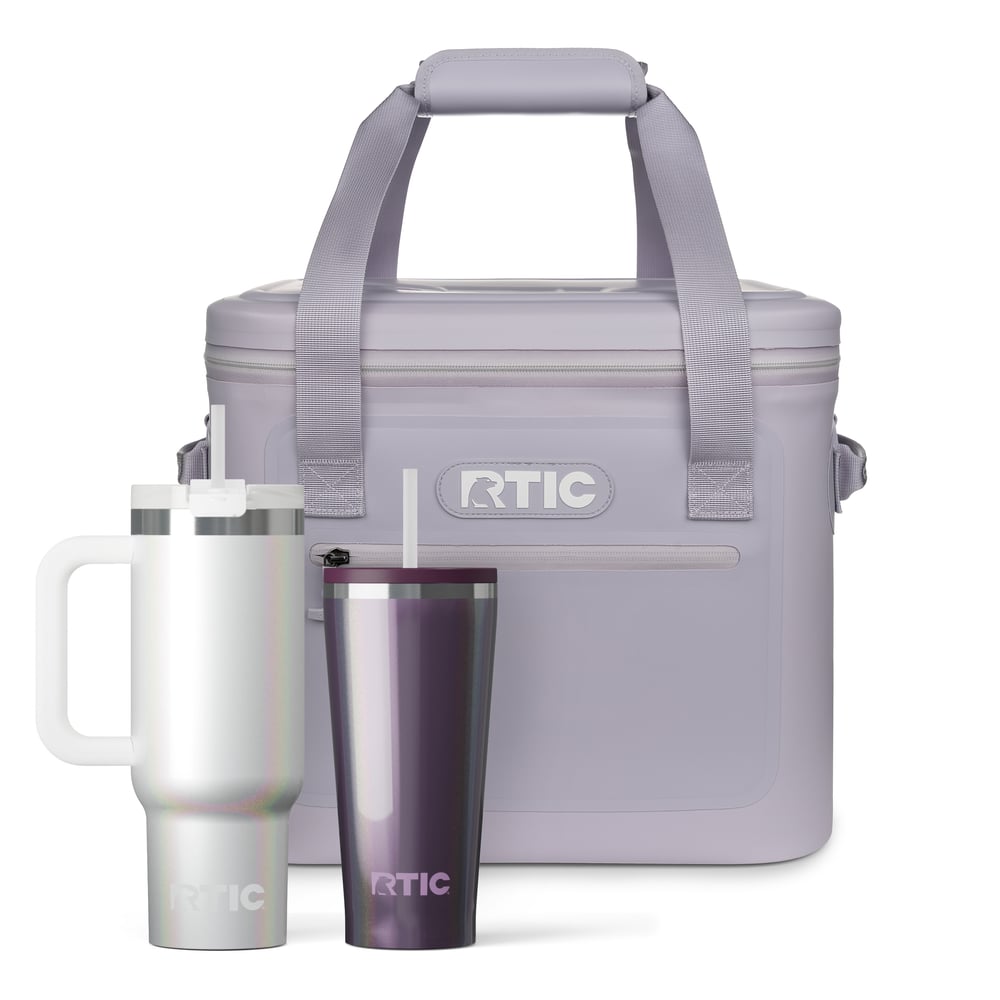 RTIC lavender soft cooler, white glitter tumbler with straw and handle, and purple glitter tumbler with straw.