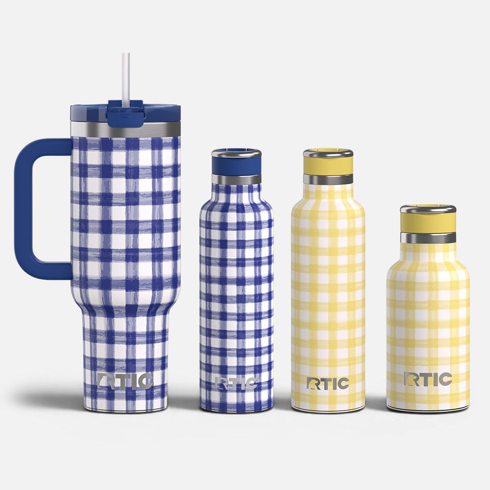 Three RTIC insulated bottles and a handled tumbler with blue and yellow plaid patterns on a clean white background.