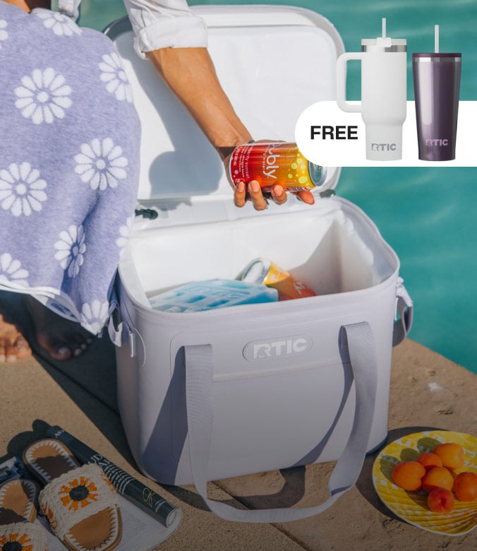 Hand placing a canned drink into a soft cooler beside a pool, with ice packs inside, towel and fruit nearby, and a promo for free insulated tumblers.