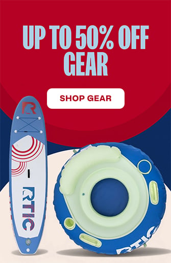 RTIC blue and green river tube next to a red, white, and blue paddle