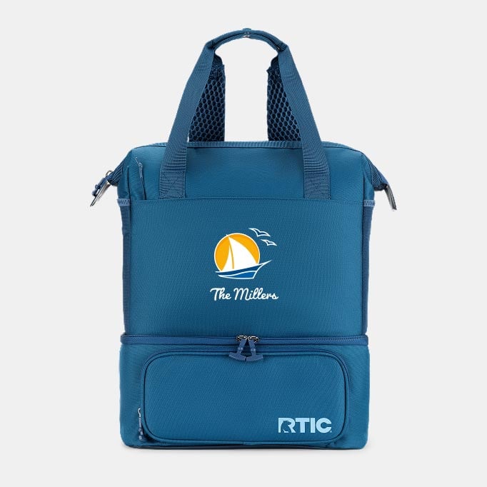 A blue RTIC backpack cooler personalized with "The Millers" and a sailboat on it on a light grey background.