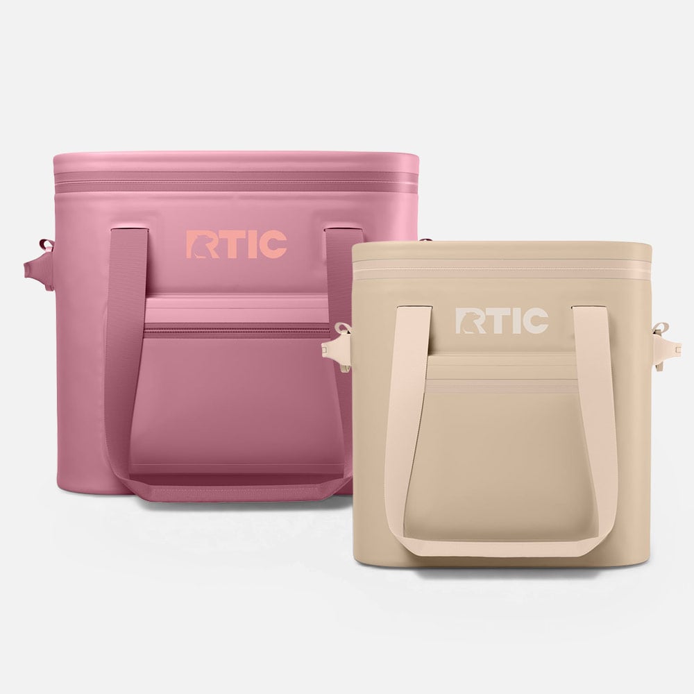 Pink and beige RTIC soft coolers with zipper lids and carry handles, shown side by side.