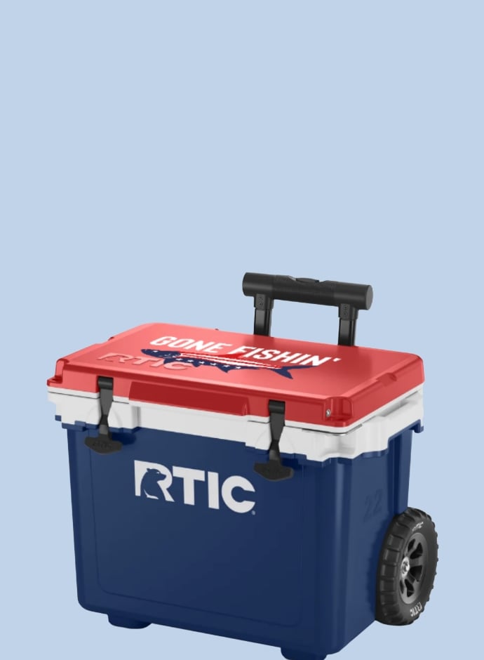 A red, white, and navy RTIC wheeled hard cooler with a fish and "Gone Fishin" printed on it - on a light blue background.