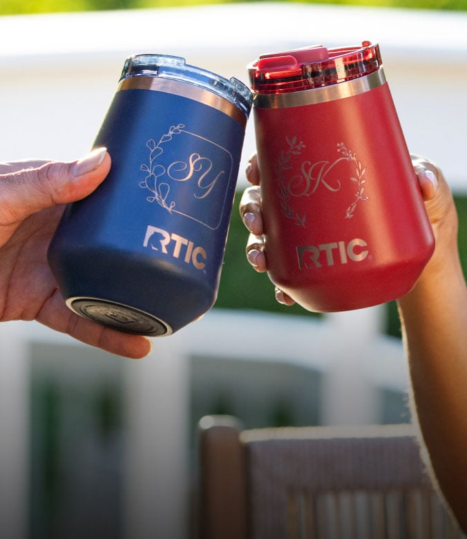 A close-up on a red and a blue RTIC Happy Hour Wine Tumbler featuring MyRTIC personalization.