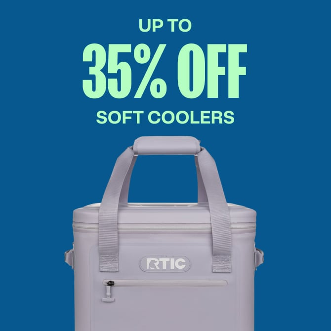 A grey RTIC soft cooler on a blue background.