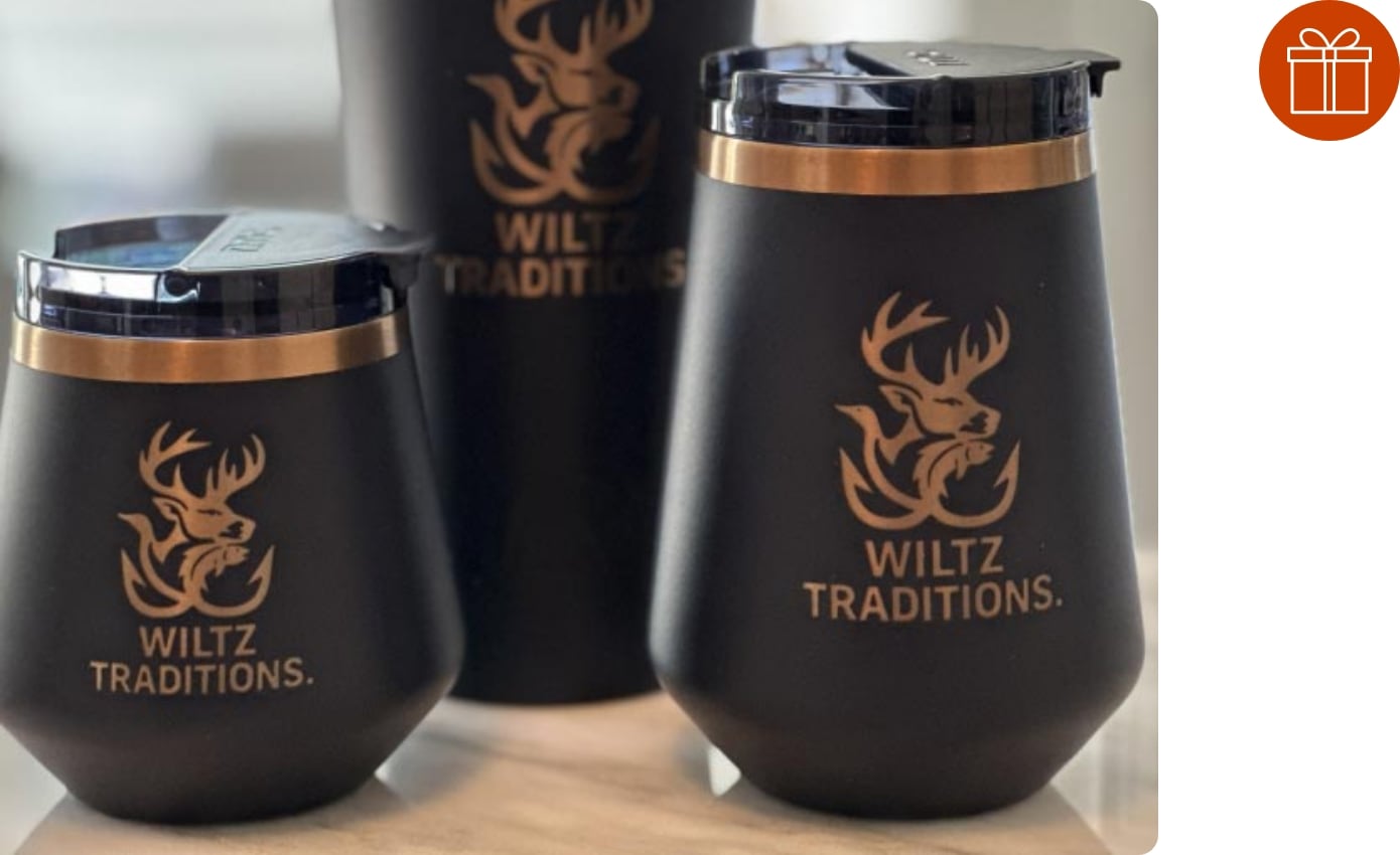 Close-up on navy RTIC Happy Hour barware with a custom logo engraved on it.